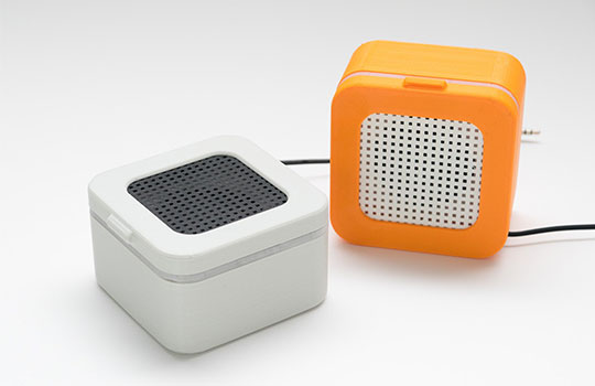 White and orange speakers