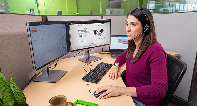 Woman sitting at computer desk