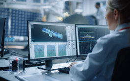 engineer working on satellite design file